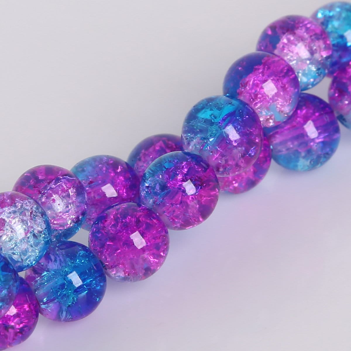 An application scenario or product detail of 6mm blue pink round crackle beads - Image 6