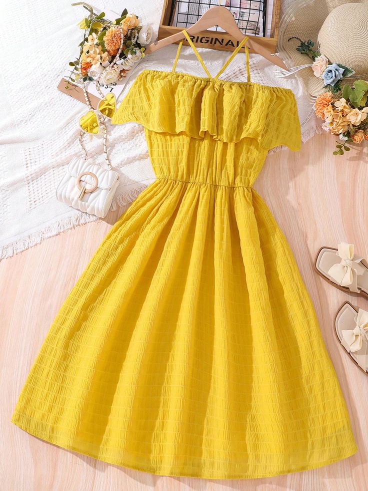 An application scenario or product detail of teen frock elastic top part in yellow - Image 5