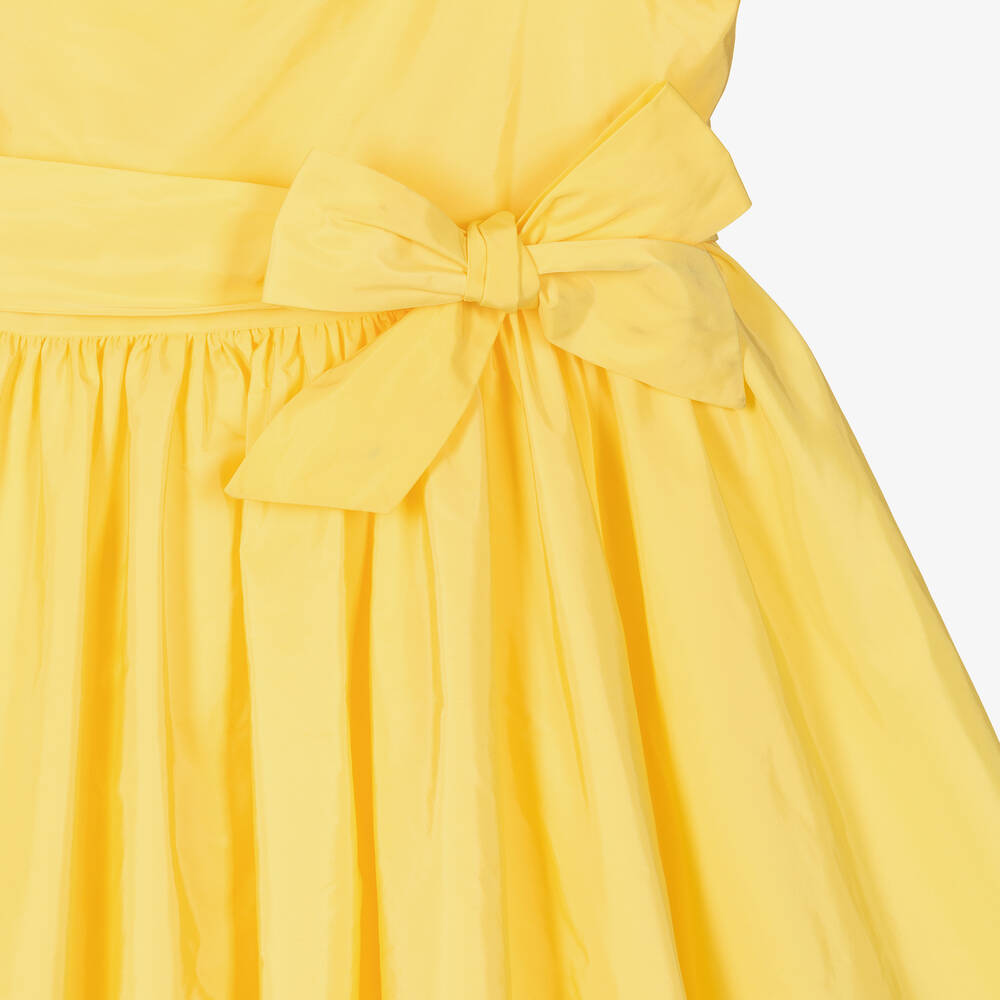 An application scenario or product detail of teen frock elastic top part in yellow - Image 12