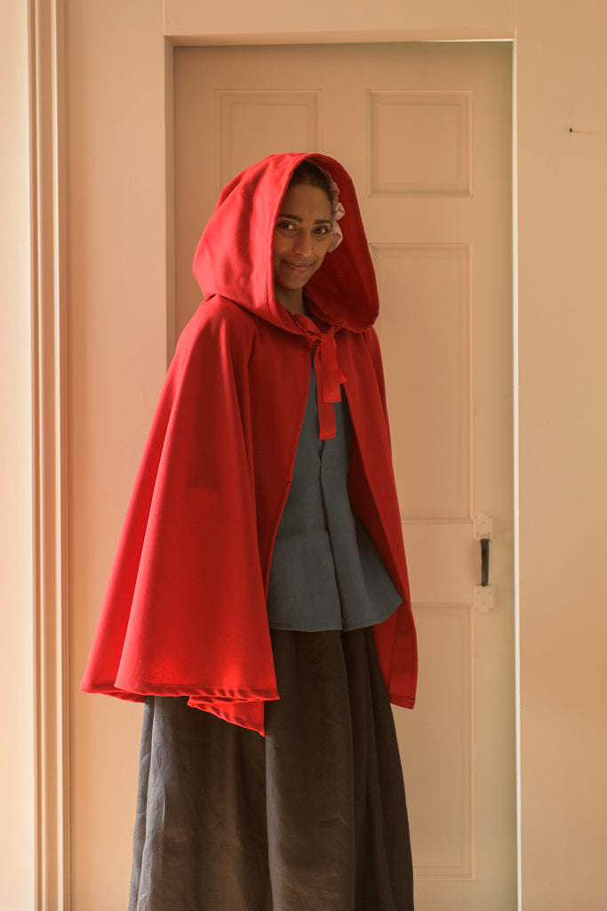 An application scenario or product detail of women's dark red short hooded cape - Image 2